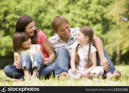 Family outdoors smiling