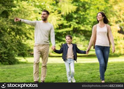 family, parenthood, adoption and people concept - happy mother, father and little girl walking in summer park