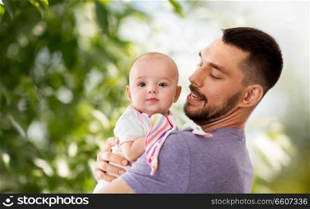 family, parenthood and people concept - father with little baby daughter. father with little baby daughter