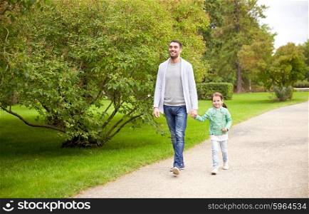 family, parenthood, fatherhood, adoption and people concept - happy father and little girl walking in summer park