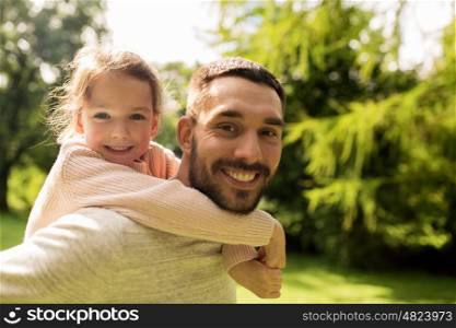 family, parenthood, fatherhood and people concept - happy father and little girl having fun in summer park
