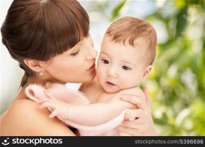 family, parenting and child care concept - happy mother with adorable baby