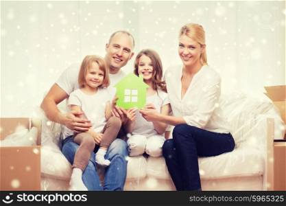 family, people, accommodation and ecology concept - smiling parents and two little girls moving into new home and waving hands over snowflakes background