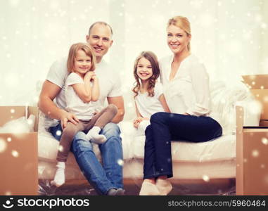 family, people, accommodation and happiness concept - smiling parents and two little girls moving into new home over snowflakes background