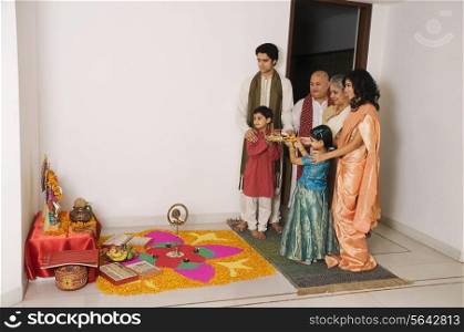 Family performing a pooja
