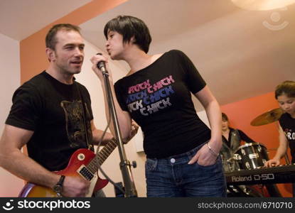 Family performing in a musical band