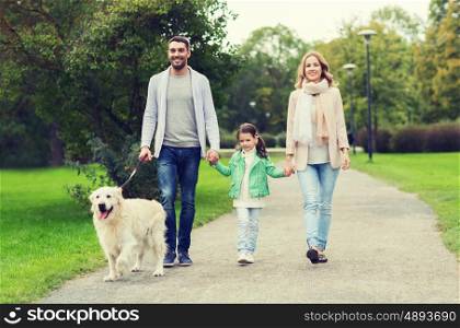 family, pet, domestic animal and people concept - happy family with labrador retriever dog walking in summer park