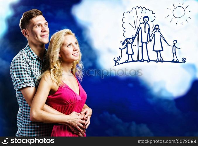 Family planning. Young happy couple dreaming about future children