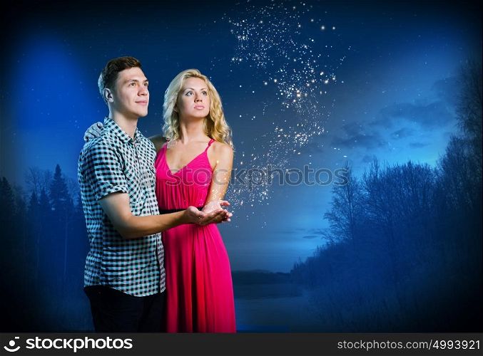 Family planning. Young happy couple hugging each other and dreaming about future