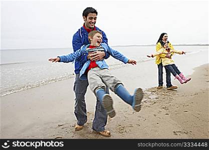 Family playing on beach