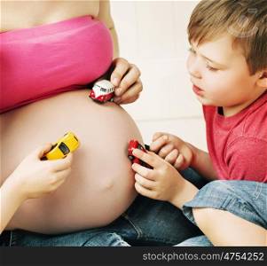 Family playing with a unborn sibling