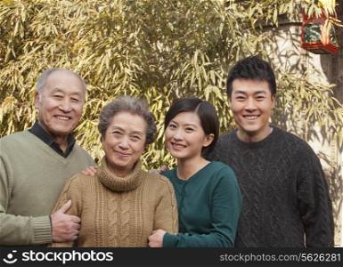 Family Portrait in front of Bamboo