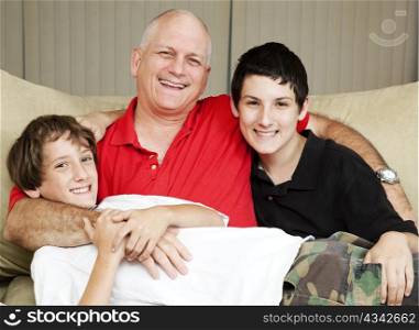 Family portrait of a loving father with his two sons.