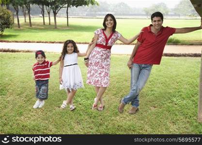 Family posing in a park