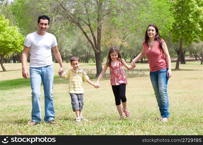 Family posing to camera in the park,outdoor