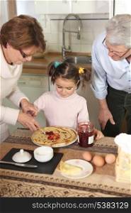 Family preparing pancakes
