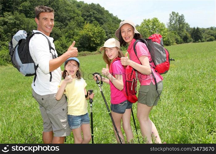Family rambling in country field