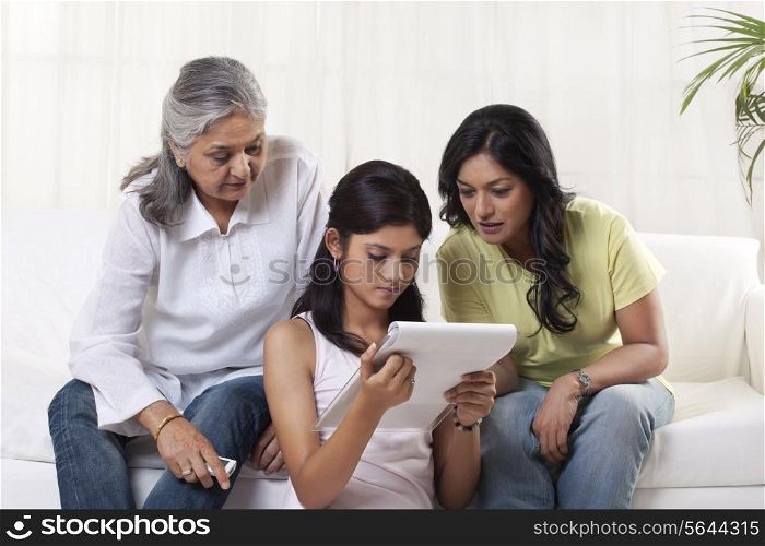 Family reading documents at home