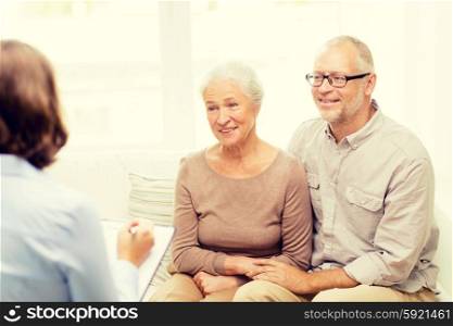 family, relations, age and people concept - happy senior couple and psychologist or social worker at home