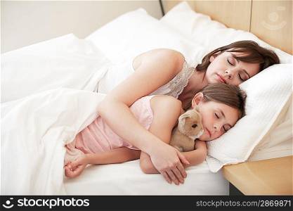 Family Relaxing in Bed