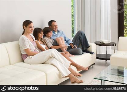 Family relaxing on a sofa