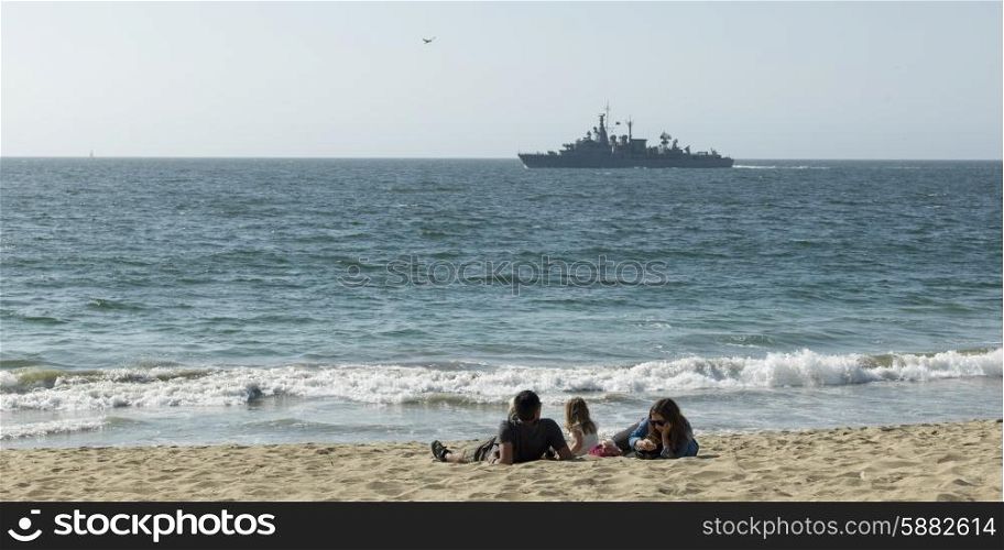 Family relaxing on the beach, Vina Del Mar, Chile
