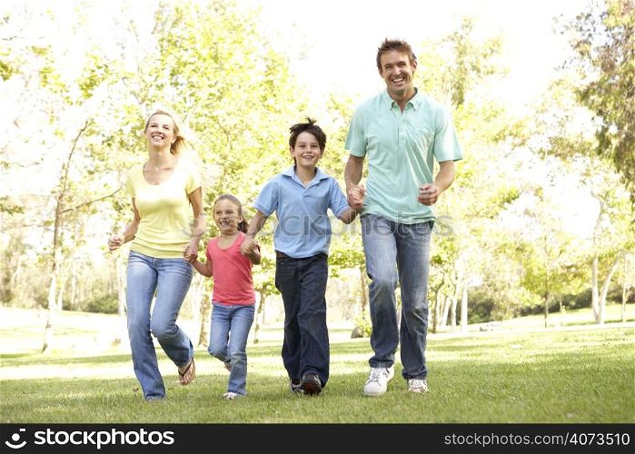 Family Running In Park