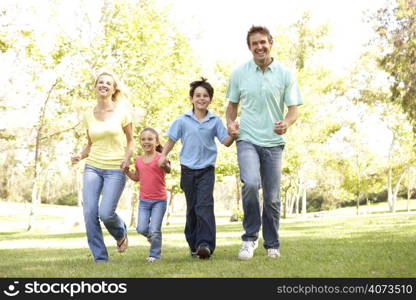 Family Running In Park