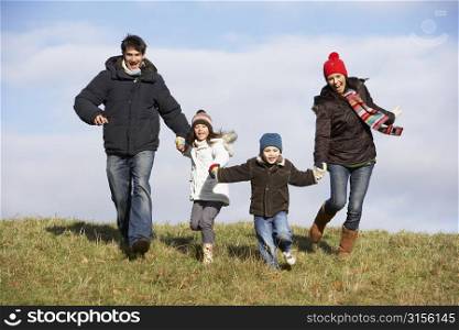 Family Running In The Park