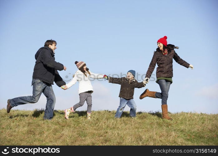 Family Running In The Park