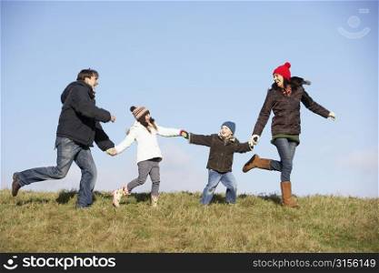 Family Running In The Park