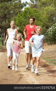 Family running on path in park