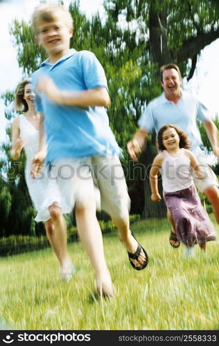 Family running outdoors smiling