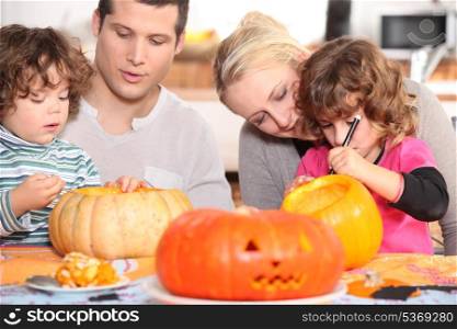 Family sculpting pumpkins