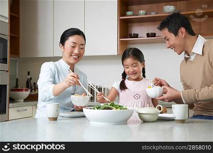 Family Serving Themselves a Meal