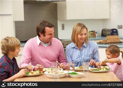 Family sharing meal together at home