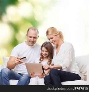 family, shopping, technology and people - smiling mother, father and little girl with tablet pc computer and credit card over green background