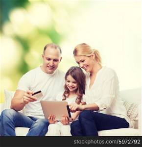 family, shopping, technology and people - smiling mother, father and little girl with tablet pc computer and credit card over green background
