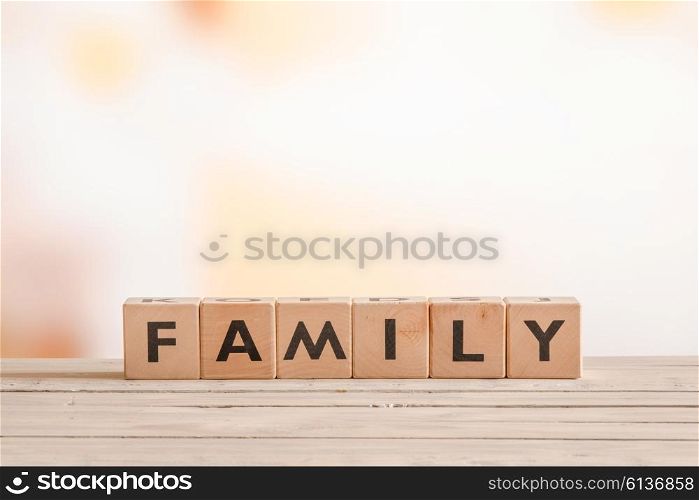 Family sign made of wood on a living room table