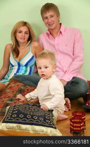 family sit on floor on pillow 2