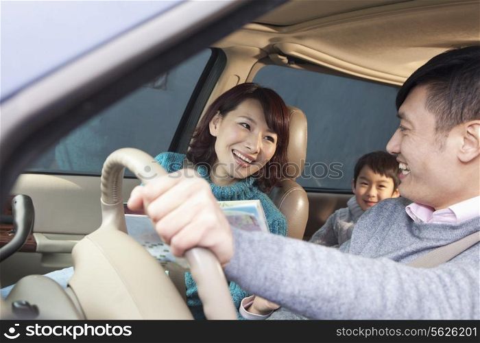 Family sitting in car, Beijing