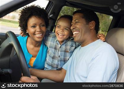 Family Sitting in Minivan