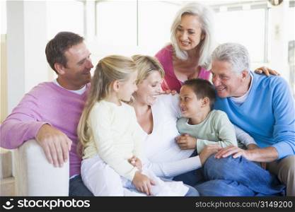Family sitting indoors smiling