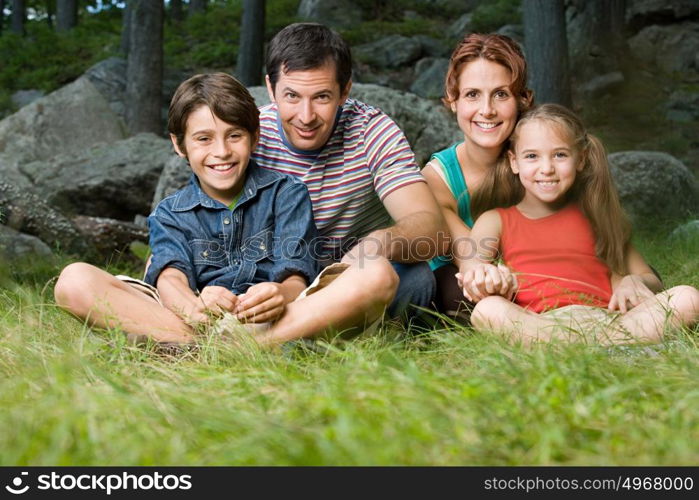 Family sitting on grass