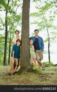 Family standing around tree