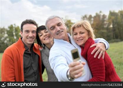 Family taking pictures in the countryside