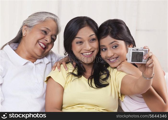 Family taking self-portrait with digital camera