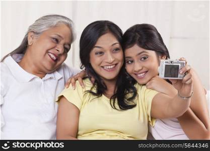 Family taking self-portrait with digital camera