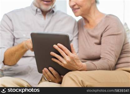 family, technology, age and people concept - close up of happy senior couple with tablet pc computer at home