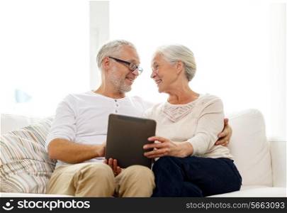 family, technology, age and people concept - happy senior couple with tablet pc computer at home